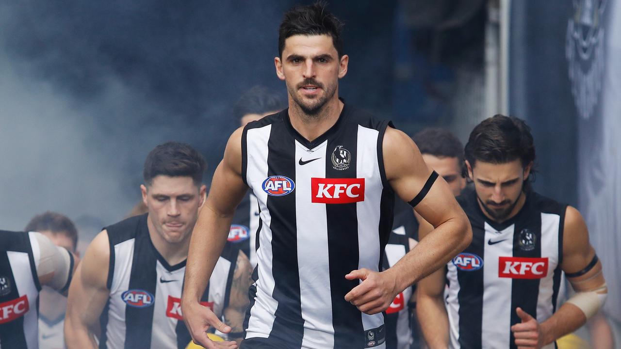 MELBOURNE, AUSTRALIA - JULY 24: Scott Pendlebury of the Magpies leads his team up the race during the 2022 AFL Round 19 match between the Collingwood Magpies and the Essendon Bombers at the Melbourne Cricket Ground on July 24, 2022 in Melbourne, Australia. (Photo by Dylan Burns/AFL Photos via Getty Images)