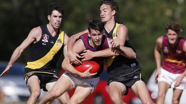 Palm Beach-Currumbin's Stephen Thynne (with ball) against Labrador. Photo: Jerad Williams