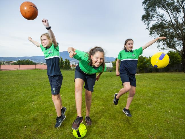 Bellerive Primary School students, from left, Celeste Fitzpatrick, 11, Nikolette Spiliopoulos, 12, and Lily Cox, 11, are excited at the prospect of Tasmania seeing Women’s World Cup action in 2023. Picture: RICHARD JUPE