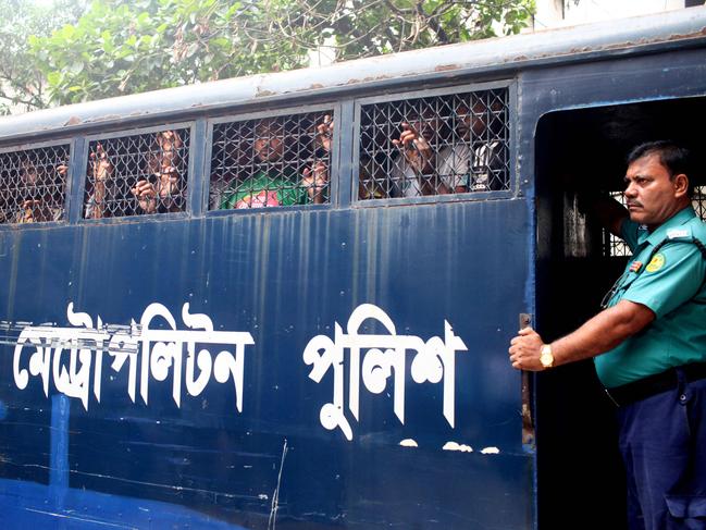 TOPSHOT - A police van transports protesters to the court, after their arrest in Dhaka on July 23, 2024. The number of arrests in days of violence in Bangladesh passed the 2,500 mark in an AFP tally on July 23, after protests over employment quotas sparked widespread unrest. (Photo by Abu SUFIAN JEWEL / AFP)