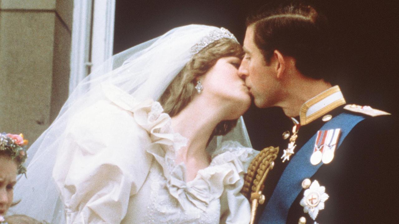 Prince Charles kisses his bride, Lady Diana, on the balcony of Buckingham Palace in 1981. Picture: AP