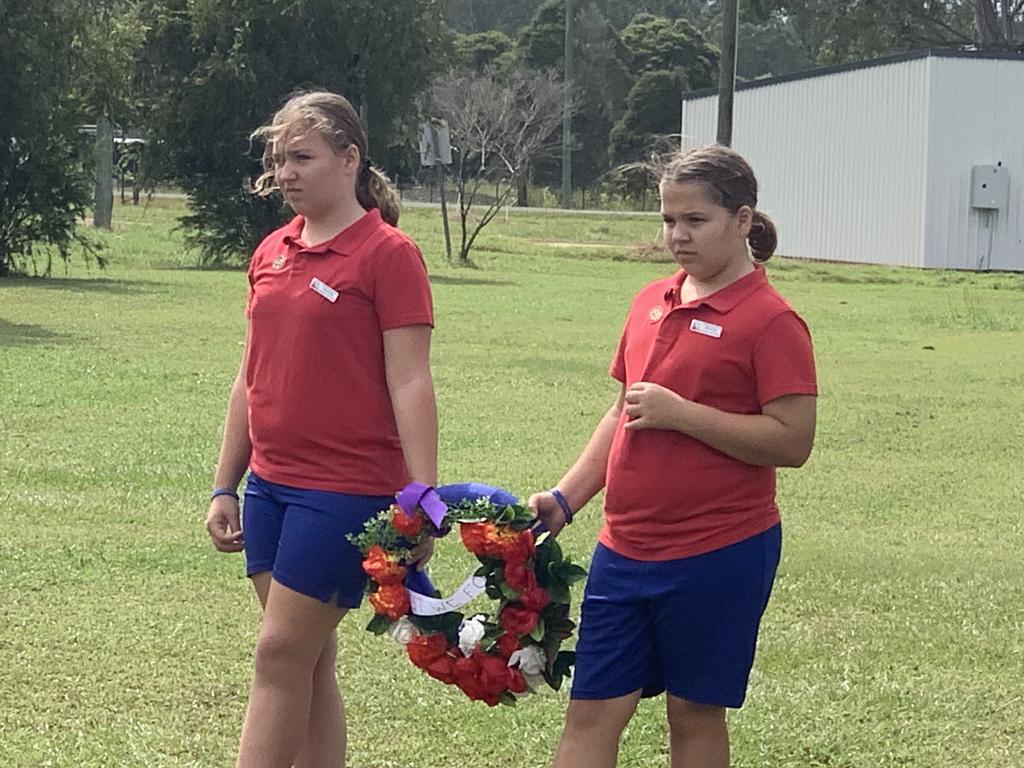 Glenwood State School students prepare to lay a wreath at the memorial.