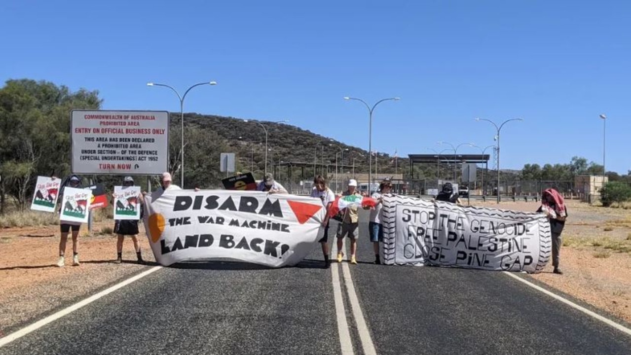 Protesters descend on doors of Pine Gap, demand facility shuts