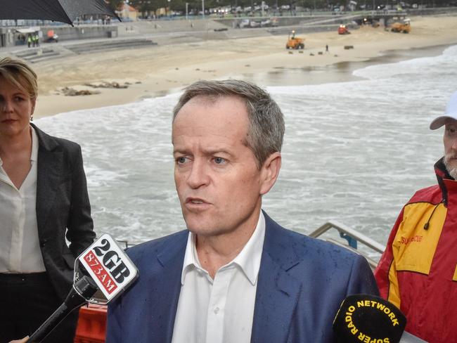 Opposition Leader Bill Shorten surveys the storm damage at Coogee, in Sydney’s eastern suburbs. Picture: Jason Edwards