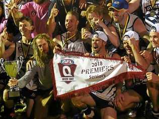 Gympie celebrates its premiership. AFL Wide Bay Grand Final: Hervey Bay Bombers v Gympie Cats at Norm McLean Oval, Torquay. Picture: Matthew McInerney