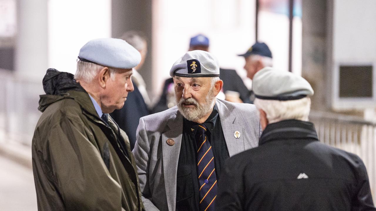 Alf Vanderhorst (centre) catches up with mates before marching to the Anzac Day dawn service, Monday, April 25, 2022. Picture: Kevin Farmer