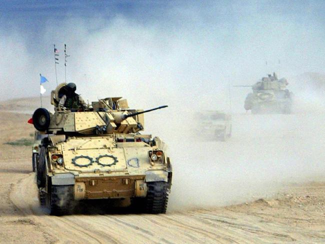 $$ FEES APPLY $$  ##### ALERT ALERT ##### BEFORE REUSE OF THIS IMAGE CHECK CONTENT AND COPYRIGHT ISSUES WITH THE /PICTURE /DESK- US. Army M2A2 Bradley Fighting Vehicles roll through the desert Dec 17, 2002 in Kuwait. The Bradleys are part of the Armoured Task Force 1-64 that is participating in an exercises for Operation Desert Spring.  (PicJoe/Raedle /Getty /Images american armed forces o/seas tanks