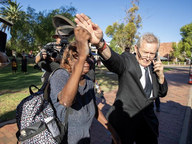 Explosive scenes outside court as a woman believed to be from Yuendumu confronts former NT police officer Zachary Rolfe after day one of him giving evidence at the inquest into the death of Kumanjayi Walker. Picture: Liam Mendes / The Australian