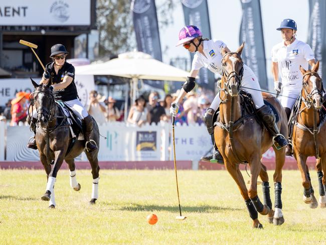 Zara Tindall and Delfina Blaquier in action during the Magic Millions Polo. Picture by Luke Marsden.