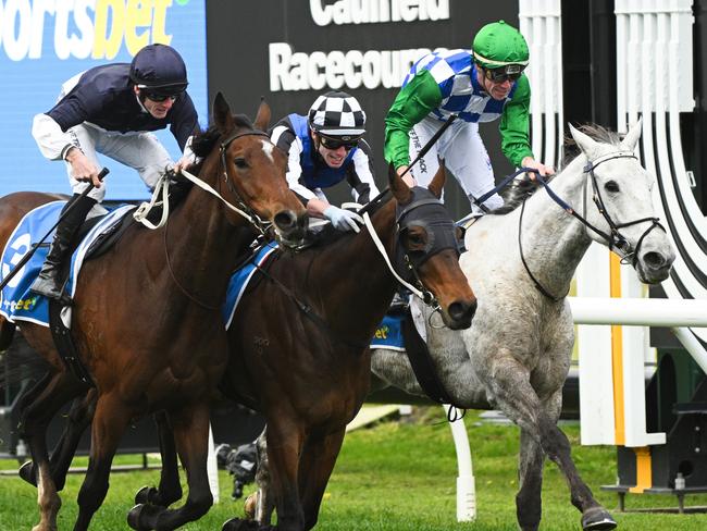 MELBOURNE, AUSTRALIA - JULY 13: Beau Mertens riding Rezone defeats Thomas Stockdale riding Eye For An Eye and Boga Legend (r) during Melbourne Racing at Caulfield Racecourse on July 13, 2024 in Melbourne, Australia. (Photo by Vince Caligiuri/Getty Images)