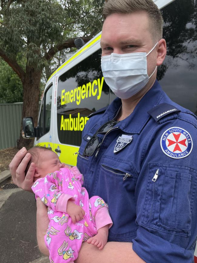 Paramedic Geoff Edwards with baby Rosie-May