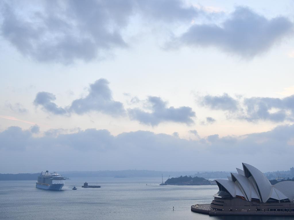 Ovation of the Seas, the cruise liner at the centre of the White Island volcano disaster, edges back into Sydney early this morning. Picture: Rohan Kelly