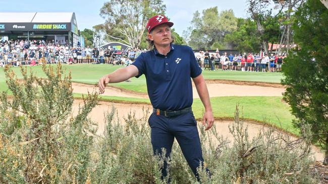 Cameron Smith looks for his ball on the ninth hole. . (Photo by Brenton Edwards / AFP)