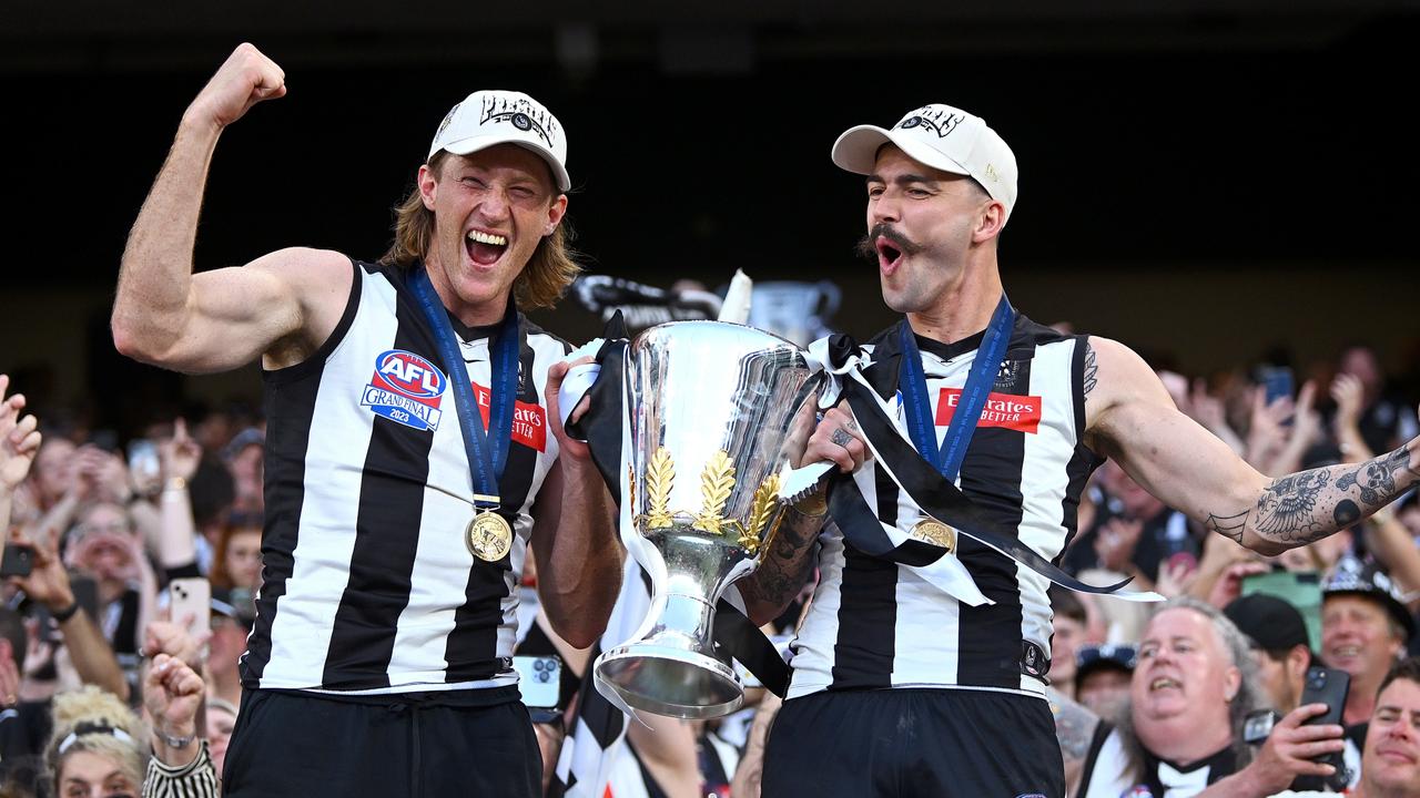 Nathan Murphy (left) celebrates Collingwood’s 2023 premiership victory with Oleg Markov. Picture: Quinn Rooney / Getty Images