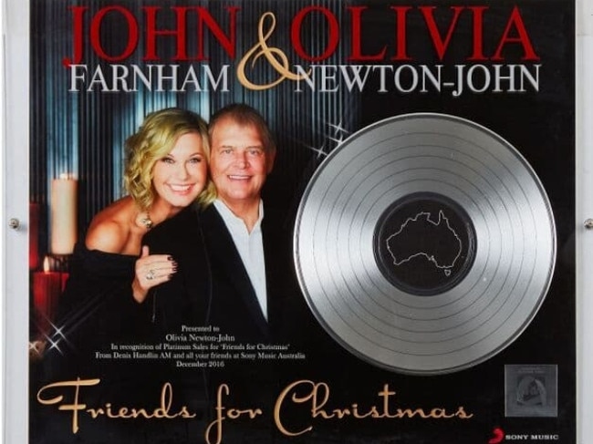 Olivia Newton-John's ARIA Platinum Record Award for the "Friends for Christmas" album she recorded with John Farnham was also sold. Picture: Supplied/Julien's Auctions