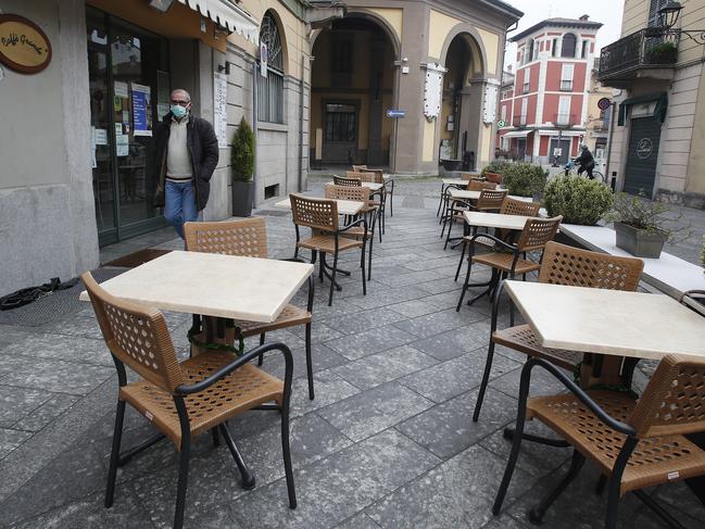 A man wearing a mask walks in Codogno, Italy. The northern Italian town recorded Italy’s first coronavirus infection. Picture: AP