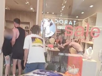 A fight between youths at Tea Tree Plaza spills over into the Mimco store . Picture: TikTok / huri640