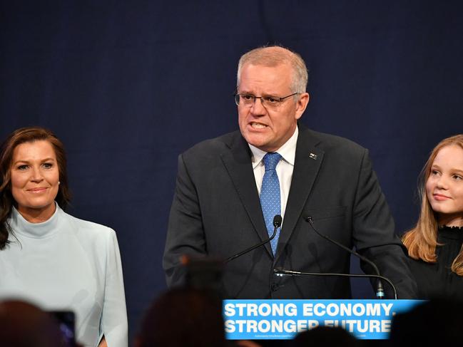 Scott Morrison, flanked by wife Jenny and his daughter, concedes defeat. Picture: AFP