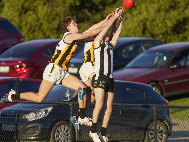 Outer East: Narre Warren and Upwey Tecoma players fly for the ball. Picture: Valeriu Campan