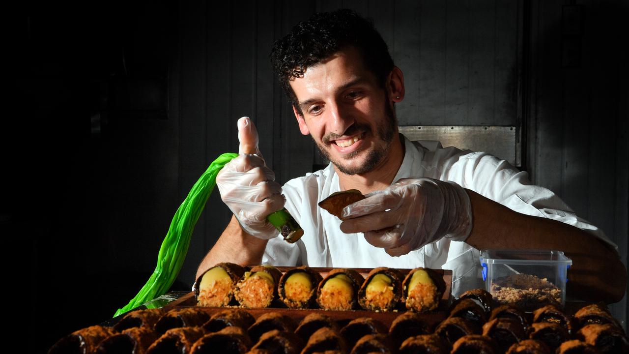 Paolo Valvoletti and Giuliana Steppa with their children Ada and Eliana Valvoletti have opened a traditional Italian patisserie at Golden Beach called Cafe Sisily. Picture: John McCutcheon