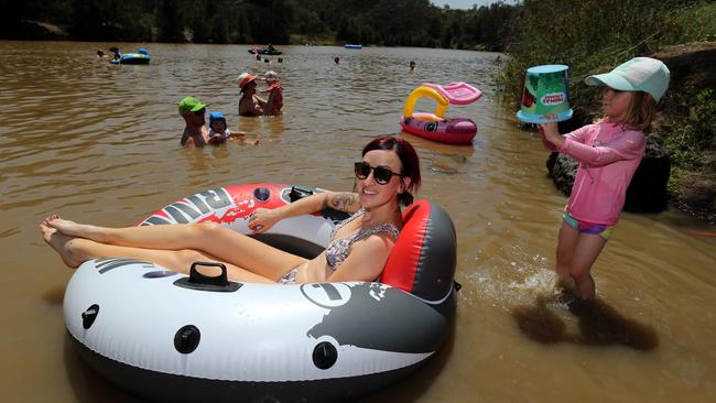 The heat sent people to the water — Carly Gugel-Partridge cooled off at Casuarina Sands swimming hole on the Murrumbidgee River. Picture: Ray Strange.