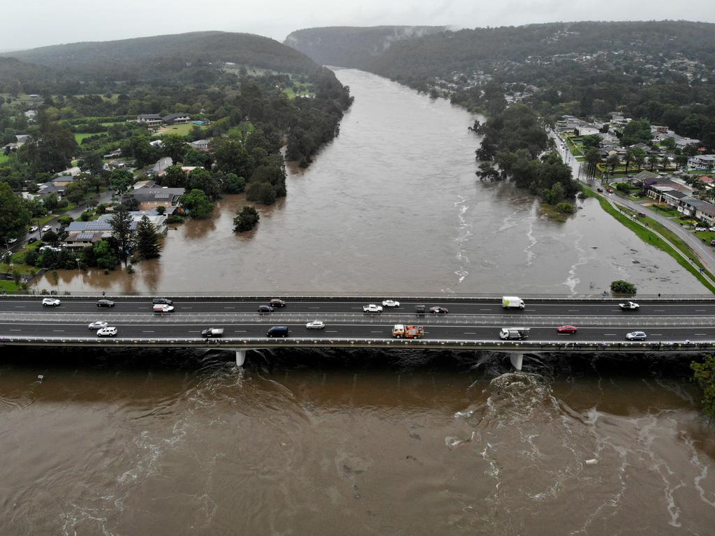 Sydney continues to be drenched in heavy rains causing flooding in local areas and the Warragamba Dam to overflow, sending millions of litres of water down the Nepean River to low lying areas like Emu Plains. Looking over the Nepean Bridge towards Warragamba Dam. Picture: Toby Zerna