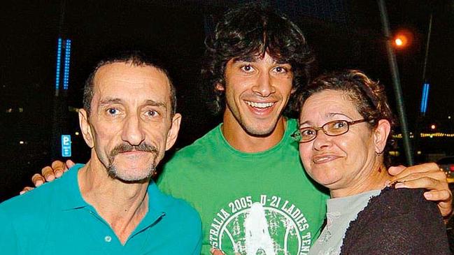 Johnathan Thurston with his parents Graeme and Debbie. Picture: Bryan Lynch