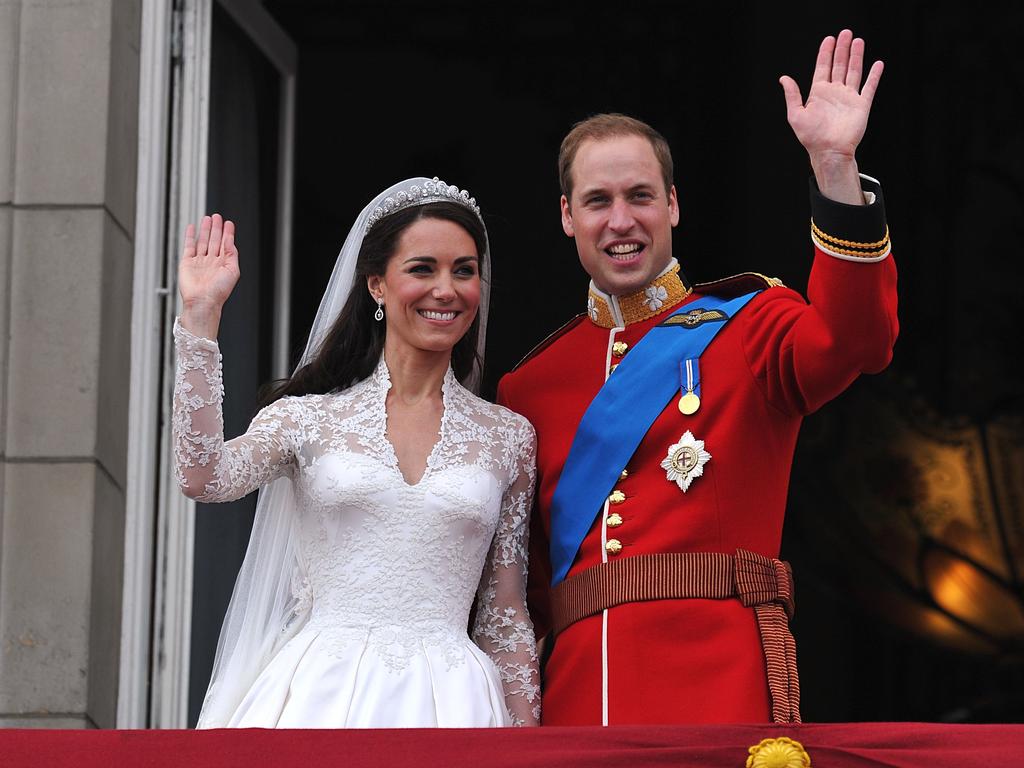 Prince William and his wife Kate, Duchess of Cambridge, wave to the crowd from the balcony of Buckingham Palace in London following their wedding. Picture: AFP