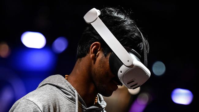 A man tries the Meta Quest 3 mixed reality VR headset during the Vivatech technology start-ups and innovation fair in Paris last week. Picture: AFP