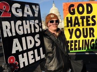  Anti-gay protesters display placards in front of the US Supreme Court on March 26, 2013 in Washington, DC. Same-sex marriage...