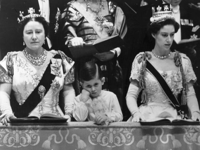 Prince Charles (centre, with the Queen Mother, left, and Princess Margaret, right) at his mother’s 1953 coronation ceremony, which despite his glumness was a joyous occasion. Picture: Topical Press Agency.