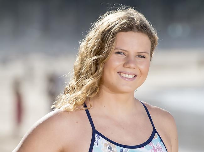 MANLY DAILY/AAP. Ironwoman Naomi Scott poses for a photograph at Manly Beach at Manly on Thursday, 5 September, 2019. Naomi Scott, 19, has just taken out a prestigious award as a junior and is now looking to make a mark in the senior ranks when the Nutri-Grain series begins. (AAP IMAGE / Troy Snook)