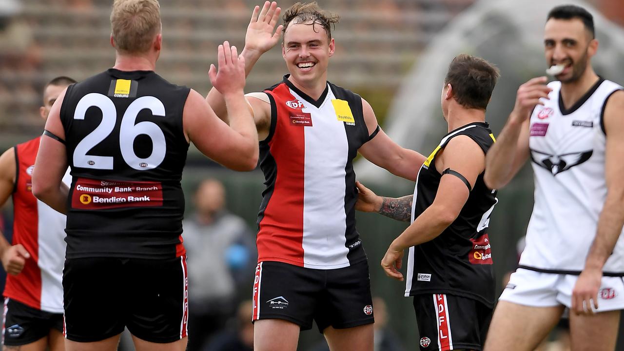 Essendon District: Liam Bowkett celebrates a goal for West Coburg against Roxburgh Park. Picture: Andy Brownbill