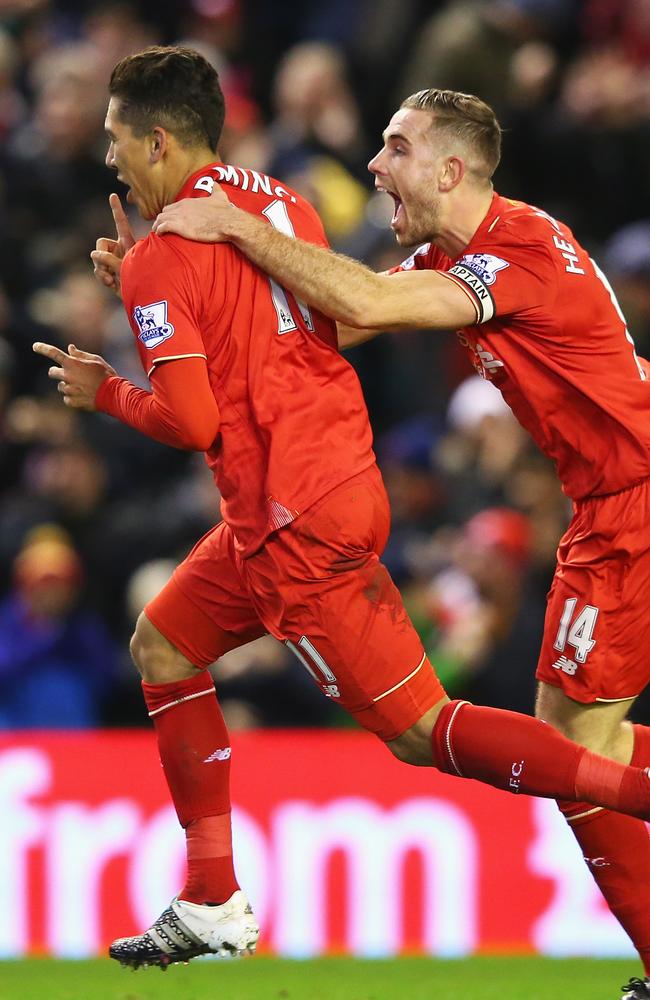 Roberto Firmino (L) of Liverpool celebrates.