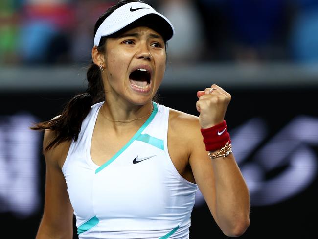 MELBOURNE, AUSTRALIA - JANUARY 18:  Emma Raducanu of Great Britain celebrates winning a point in her first round singles match against Sloane Stephens of United States during day 2 of the 2022 Australian Open at Melbourne Park on January 18, 2022 in Melbourne, Australia. (Photo by Clive Brunskill/Getty Images)