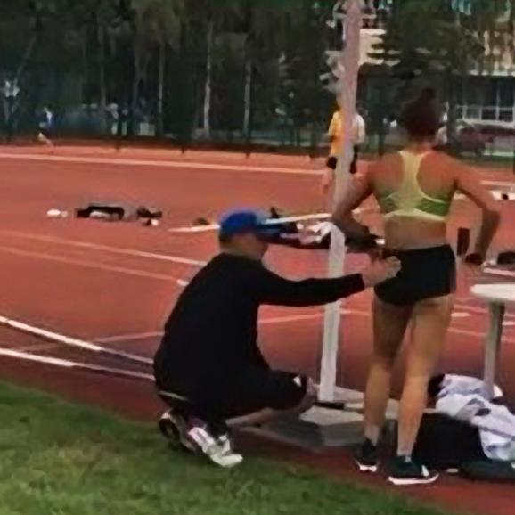 An undated video posted to Instagram showing coach Alex Parnov stroking the back and backside of Olympic pole vaulter Nina Kennedy