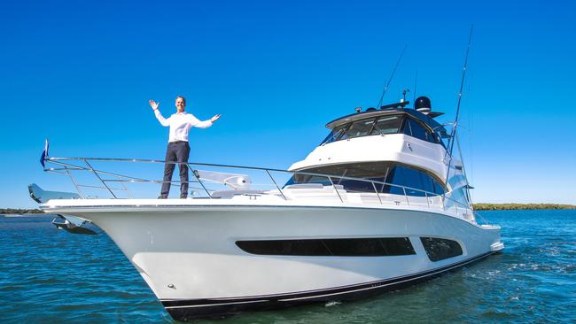 Riviera boss Rodney Longhurst with the company's new $3.2 million 64 Sports Motor Yacht. : NIGEL HALLETT