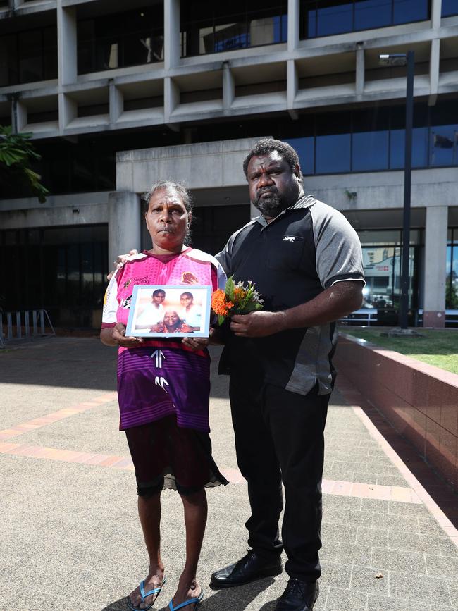 Allison Bernard's mother and uncle Edwina Bernard and Teddy Bernard, pictured with a photo of Ms Bernard (left) with her grandmother and sister. The pair were in the Cairns Coroner's Court on the first day of the coronial inquest into Ms Bernard's disappearance. Picture: Brendan Radke