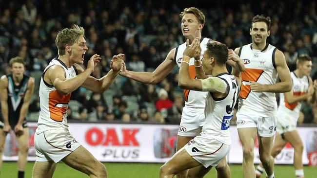 Jackson Hately, left, celebrates a goal with GWS teammates against the Power in Round 19. Picture: SARAH REED