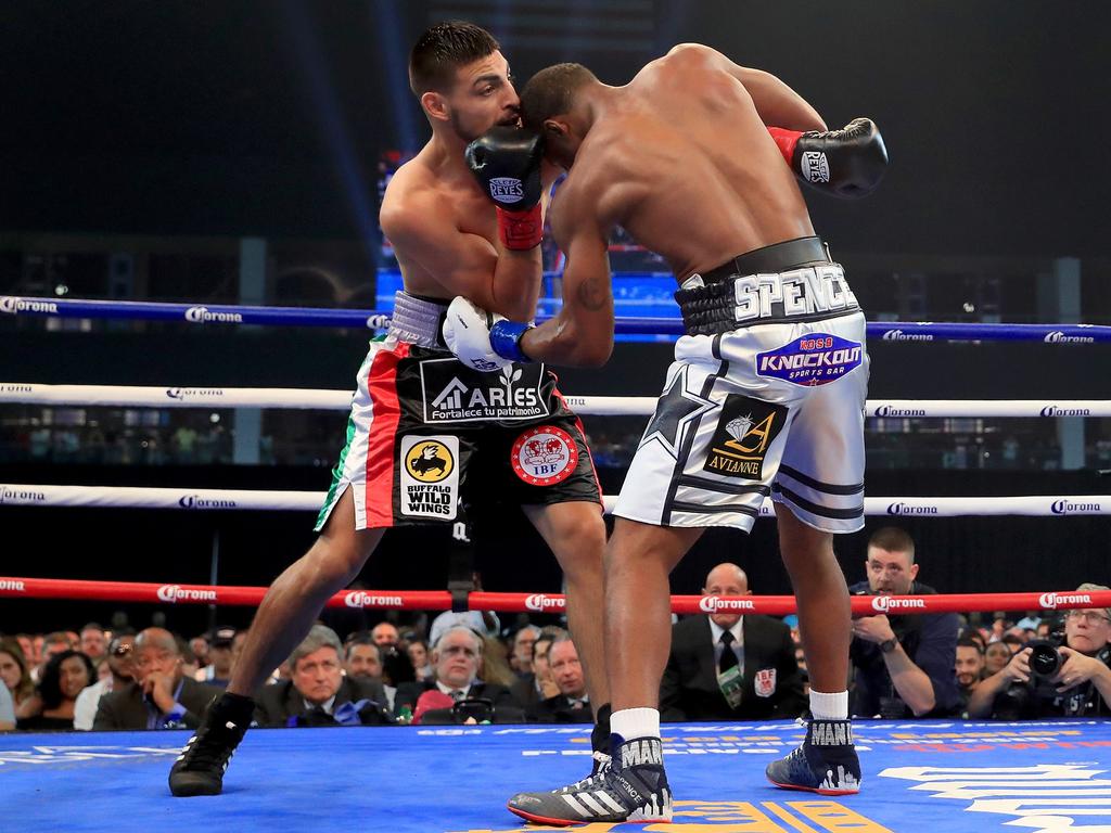 Errol Spence Jr. lands a body shot on Carlos Ocampo in the first round of a IBF Welterweight Championship bout.