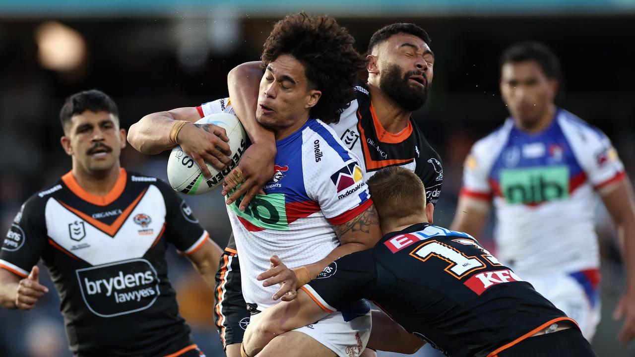 SYDNEY, AUSTRALIA - AUGUST 07: Pasami Saulo of the Knights is tackled during the round 21 NRL match between the Wests Tigers and the Newcastle Knights at Campbelltown Stadium, on August 07, 2022, in Sydney, Australia. (Photo by Cameron Spencer/Getty Images)