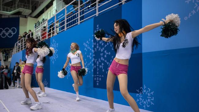 South Korean cheerleaders perform during the women's preliminary round ice hockey match between Sweden and the Korean team.