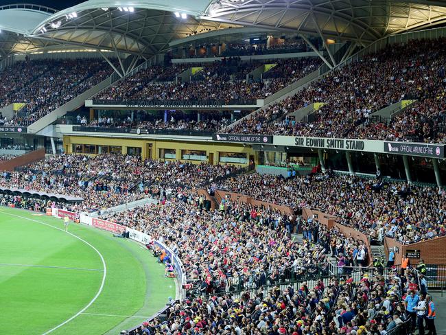 Packed crowds at Adelaide Oval catch a game between the Adelaide Crows and the Geelong Cats. Getting bums on seats will be a challenge even after lockdown. Picture: Bianca De Marchi