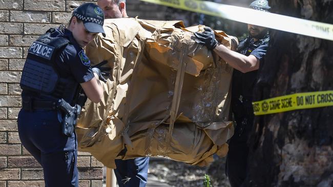 An armchair, wrapped in paper, was removed from one of the houses. Picture: Roy VanDerVegt