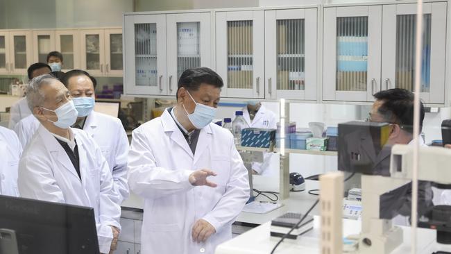 Xi Jinping, centre, visits the Academy of Military Medical Sciences in Beijing last week. Picture: AP