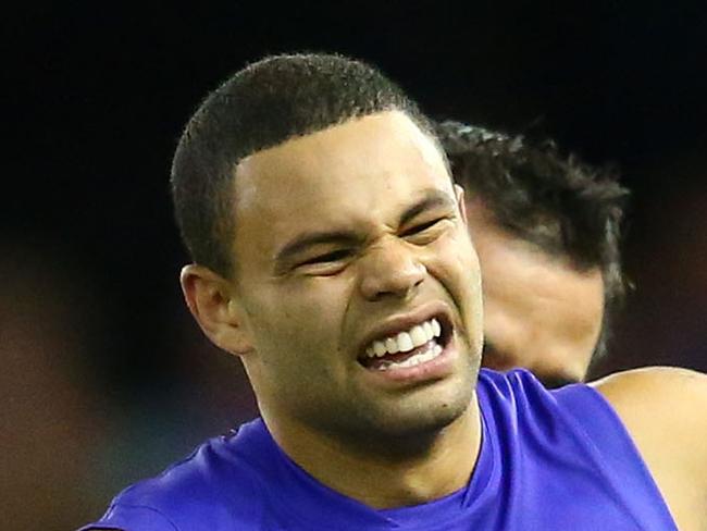 MELBOURNE, VICTORIA - APRIL 16: Jason Johannisen of the Bulldogs leaves the field injured during the round four AFL match between the Carlton Blues and the Western Bulldogs at Etihad Stadium on April 16, 2016 in Melbourne, Australia. (Photo by Scott Barbour/AFL Media/Getty Images)