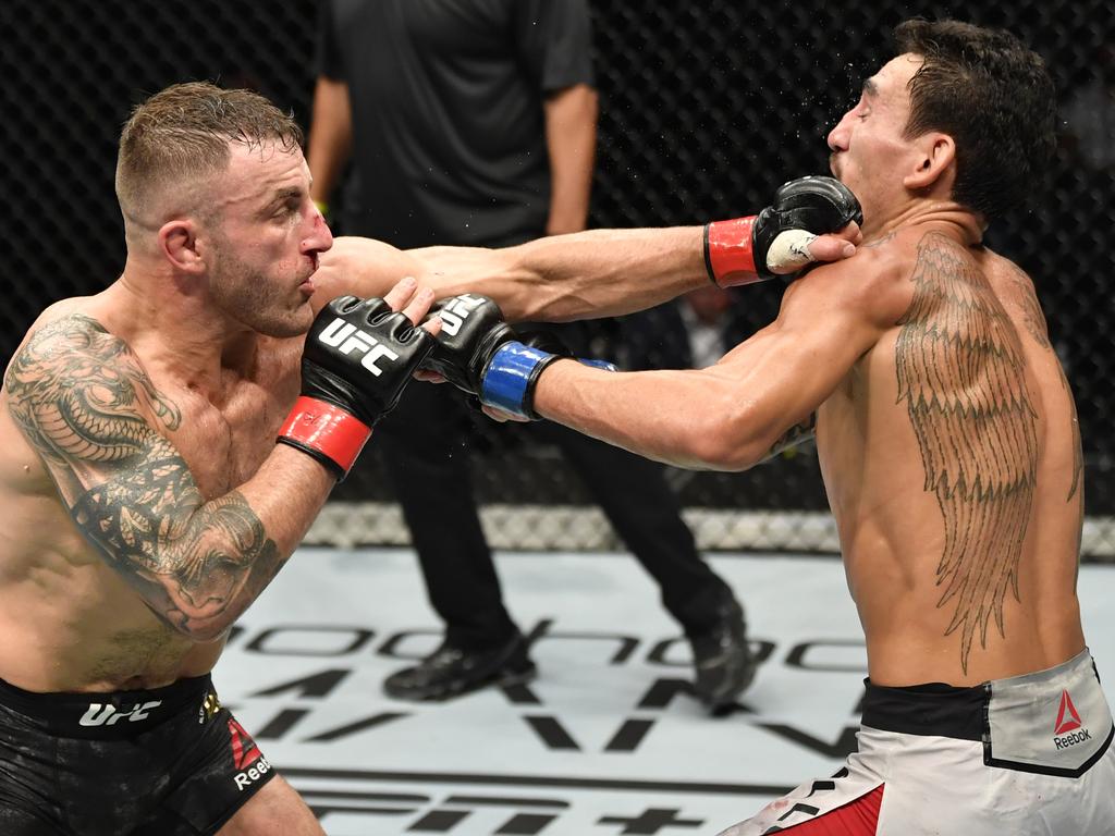 Volkanovski punches Max Holloway. (Photo by Jeff Bottari/Zuffa LLC via Getty Images)