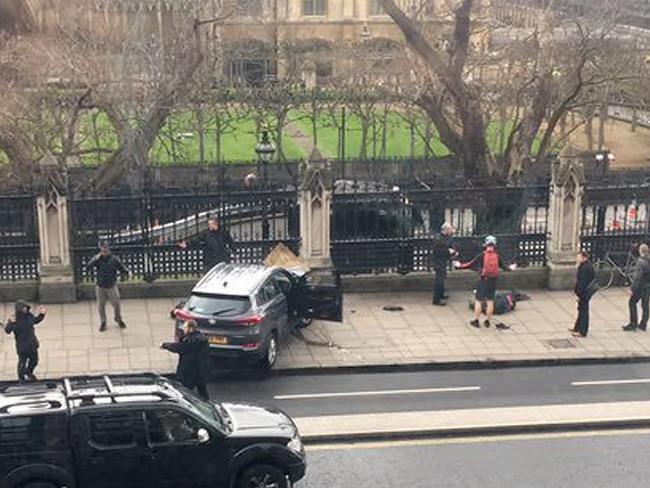 The attacker’s vehicle then crashed into the metal fence around Parliament. Picture: James West via AP