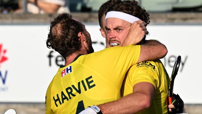 Australia’s Cooper Burns (R) celebrates his goal with teammates during the men's field hockey match between Australia and the Netherlands in the FIH Hockey Pro League in Sydney. Photo: AFP