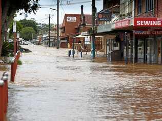 Heavy flood water tearing through the Lismore CBD in April this year. Picture: Marc Stapelberg